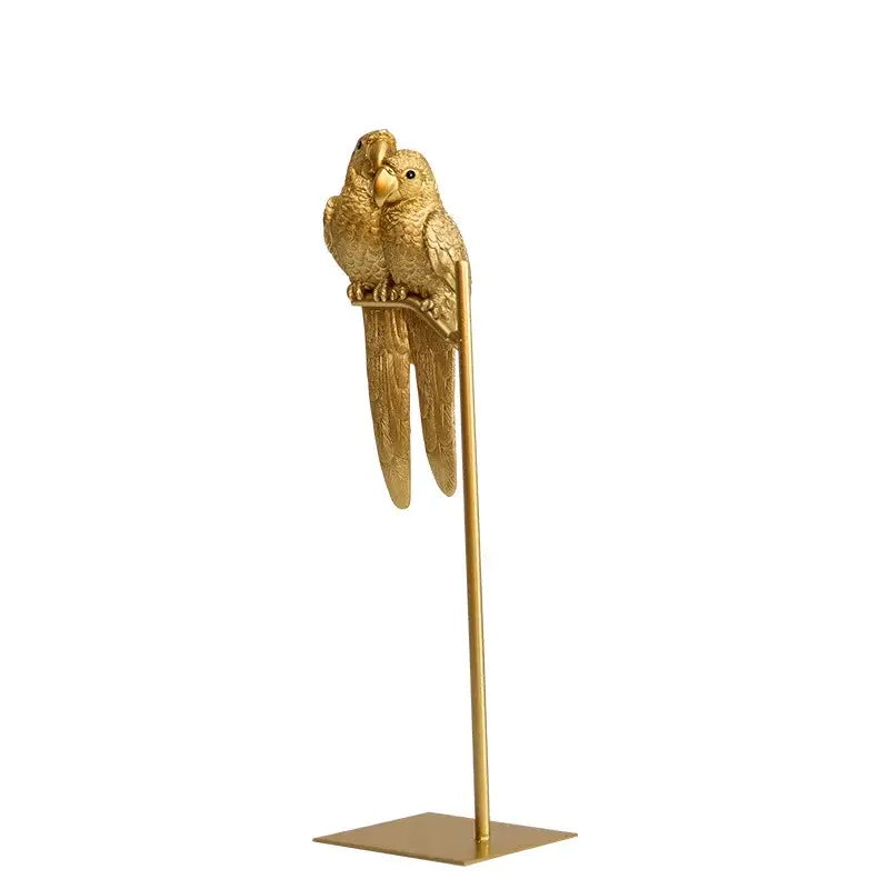 Golden metallic resin ornament of two parrots perched on a stand decorbites lucky parrot modern home decor gift