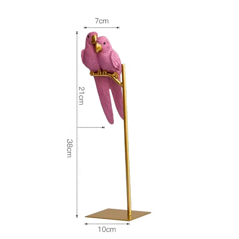 Pink resin ornament parrot figurine with gold beaks and feet on a slender golden stand by decorbites lucky parrot