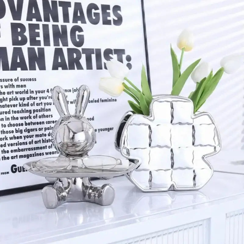 Silver decorbites lucky rabbit key tray and matching cross vase with reflective metallic surfaces and intricate details