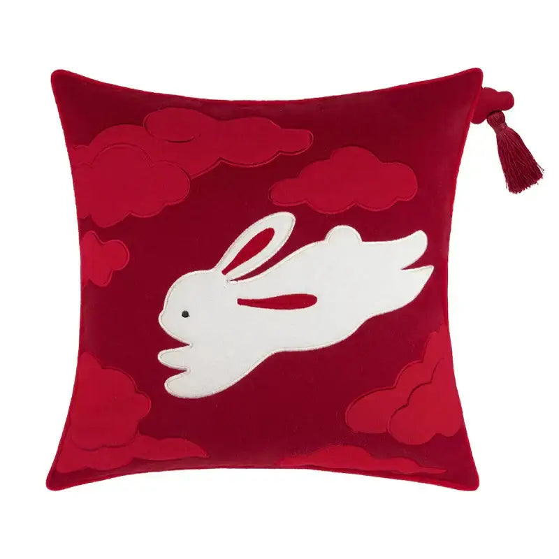 A plush red velvet decorbites lucky rabbit pillowcase with white embroidered rabbit and pine forests motif tassel
