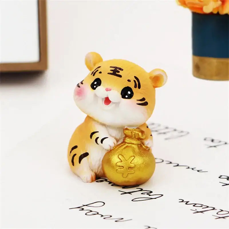 Decorbites lucky tiger figurine in yellow and white holding a golden money bag with chinese yuan symbol for home decor