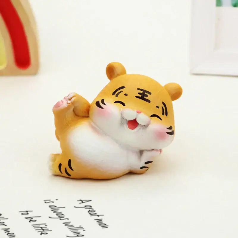 Decorbites™ lucky tiger figurine featuring a cute orange and white tiger with black stripes and pink cheeks smiling face
