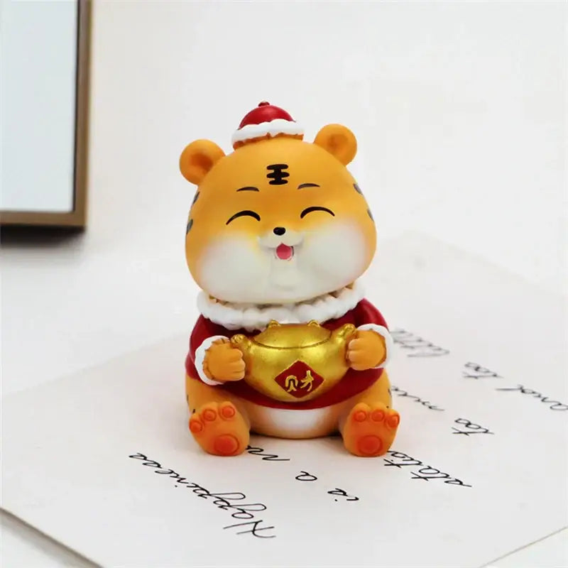 Cute orange lucky tiger figurine wearing red santa hat and festive robe holding golden money pot for new year decor