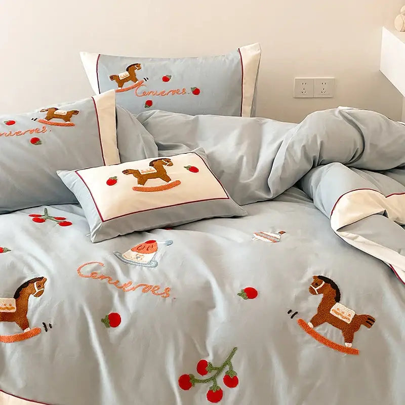 Light blue DecorBites Lucky Trojan cotton embroidered bedding set with wooden rocking horse and cherry motifs on duvet cover