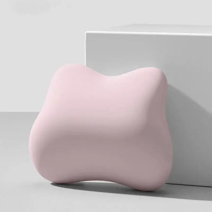 Decorbites lumbar support memory foam cushion in soft pastel pink with contoured surface for office chair and car seat
