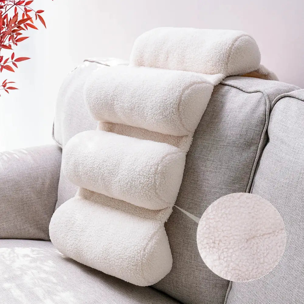 White plush sheepskin lumbar support pillow with four tiered segments for adjustable office chair back support