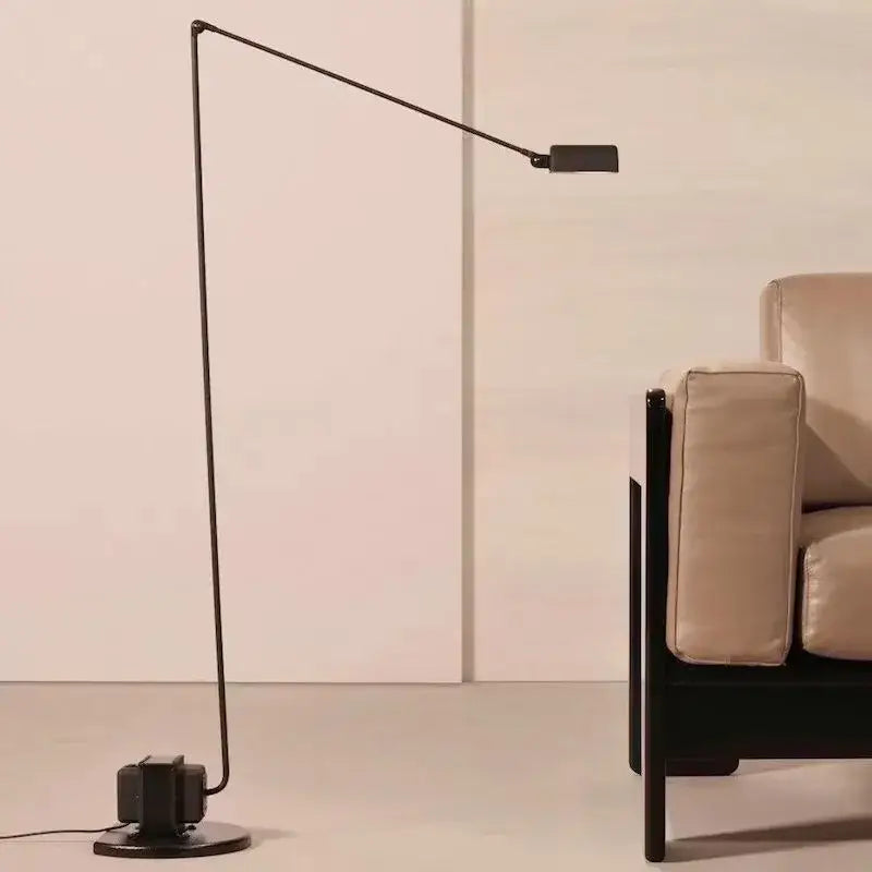Black metal decorbites lumina floor lamp with slender articulated long arm and rectangular head for reading and study