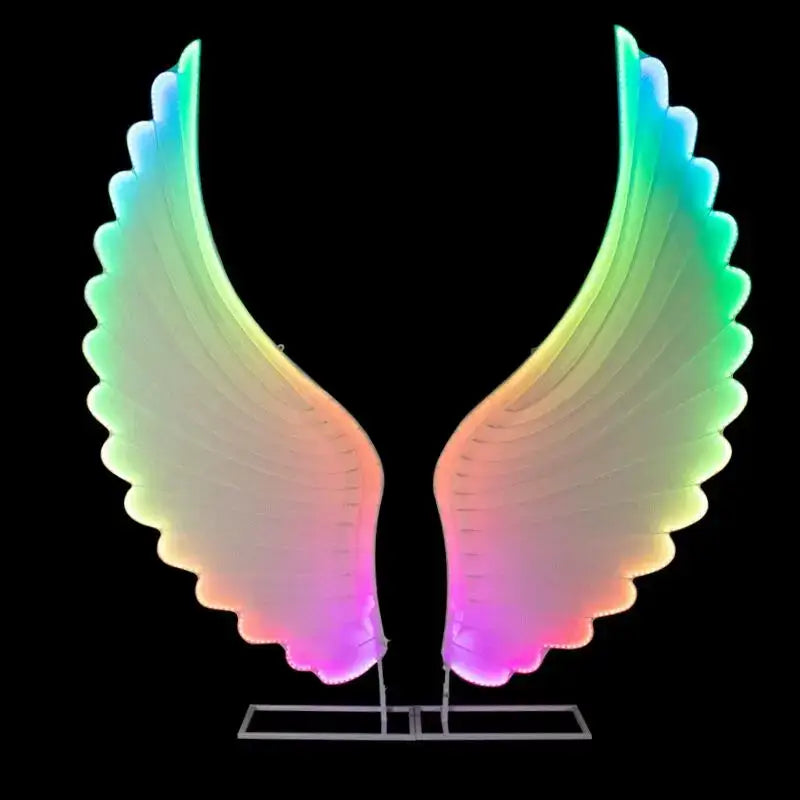 DecorBites luminescent angel wings led decoration lamp with iridescent pink to green glow on a sleek metallic stand