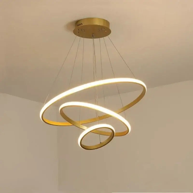 Modern gold-finished decorbites luminous circle pendant light with three interlocking illuminated rings in four colors