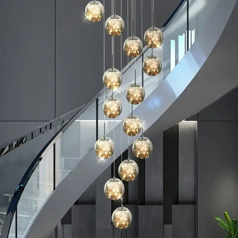 A modern DecorBites luminous glass pendant chandelier with warm golden glass ball orbs for living dining room decor