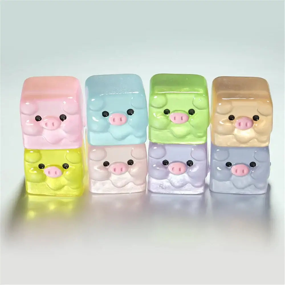 Set of six pastel-colored translucent resin pig figurines with glossy finish by decorbites luminous resin cactus collection