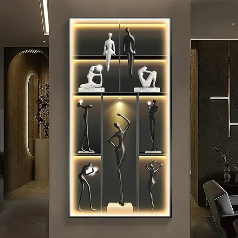 Set of eight minimalist black and white abstract human figure sculptures on decorbites luminous wall mural shelf unit
