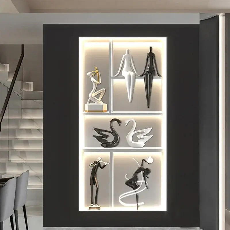 Black and white abstract figurines displayed in a modern illuminated shelving unit of decorbites luminous wall mural
