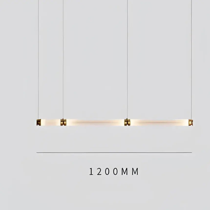 A sleek luna glass tube chandelier with four cylindrical glass tubes suspended by cables for kitchen or dining lighting