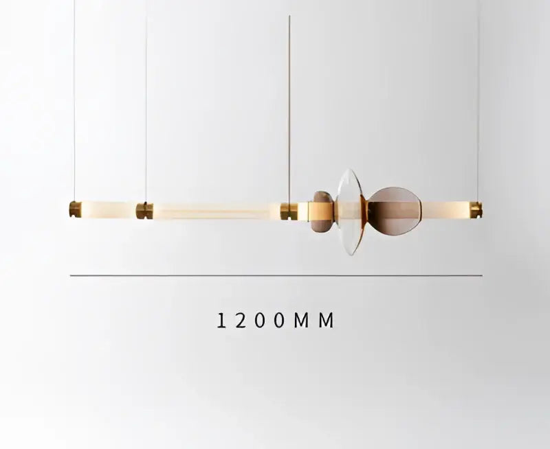 A modern luna glass tube chandelier pendant light with a beige glass tube and gold-toned accents for kitchen or dining