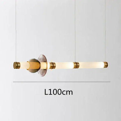 Modern minimalist luna glass tube chandelier with frosted glass tubes and warm brass accents for kitchen and dining areas
