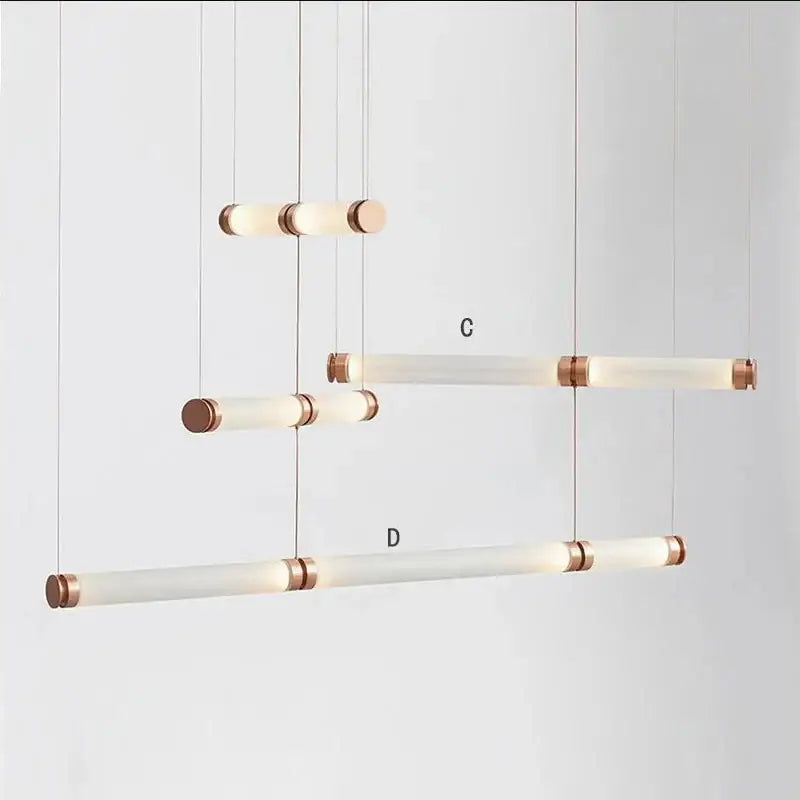 Modern minimalist luna glass tube chandelier with frosted glass tubes and brushed copper end caps for kitchen lighting