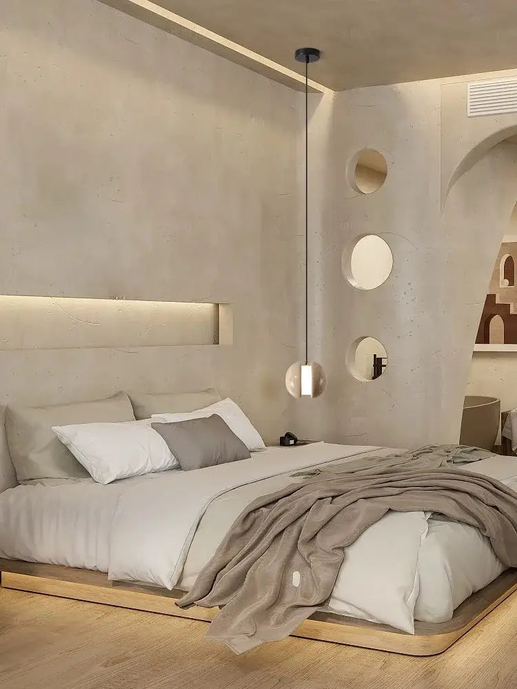 Modern minimalist bed with sleek wooden frame and upholstered headboard paired with decorbites lunar stone pendant chandelier in soft beige and gray hues