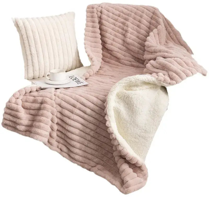 A plush pink decorbites luxe double-layer blanket with ribbed faux-rabbit fur and soft white sherpa lining for warmth