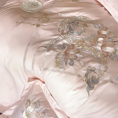 Pink satin bedding set with intricate gold and silver floral embroidery from decorbites luxe floral bird collection