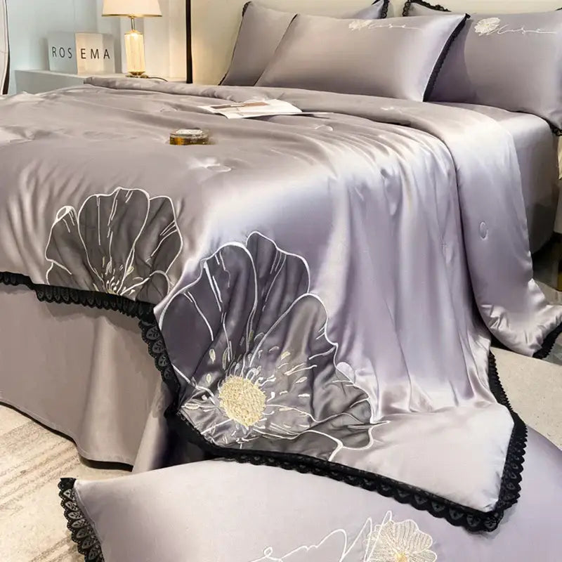 Silk satin quilt set with luxe flower embroidered gray floral design and black lace trim by decorbites luxe flower