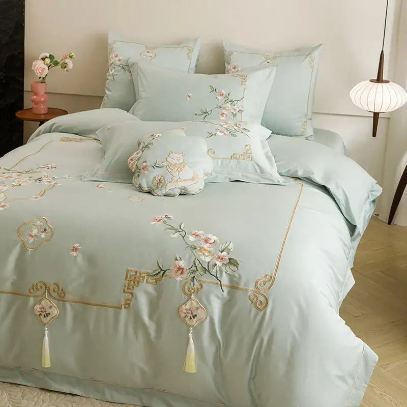 Light blue decorbites luxe flowers embroidered bedding set in egyptian cotton with pink floral and cat motifs and tassels