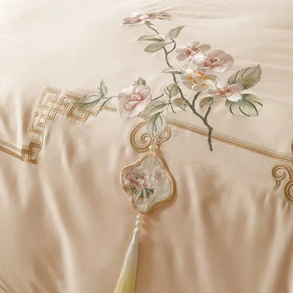 Beige satin pillowcase with pink white floral embroidery and gold geometric border in decorbites luxe flowers egyptian cotton bedding set