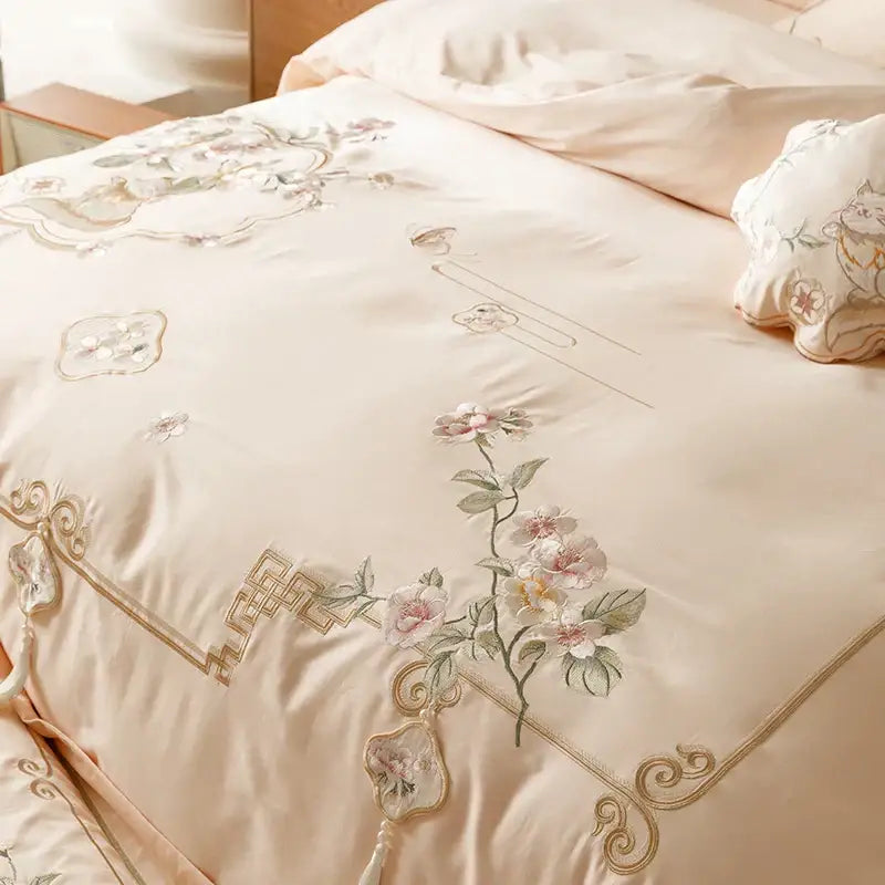 Cream-colored satin duvet cover with pink gold floral embroidery and chinese border in decorbites luxe flowers egyptian cotton bedding set