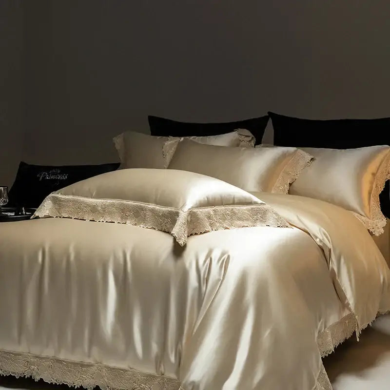 Cream-colored satin bedding set with delicate luxe french lace trim from decorbites luxe french collection made of silk lyocell cotton