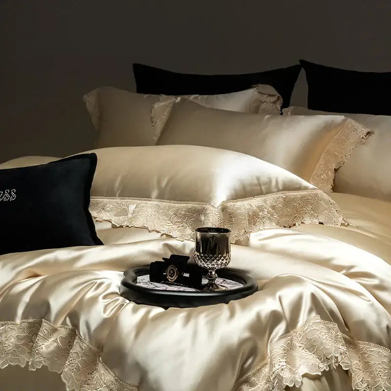 Cream-colored satin bedding set with delicate luxe french lace trim made of silky lyocell cotton by decorbites luxe french