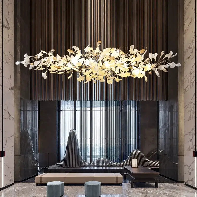 A gold-toned decorbites luxe ginkgo pendant light with leaf-shaped elements on a dark wooden slat wall background
