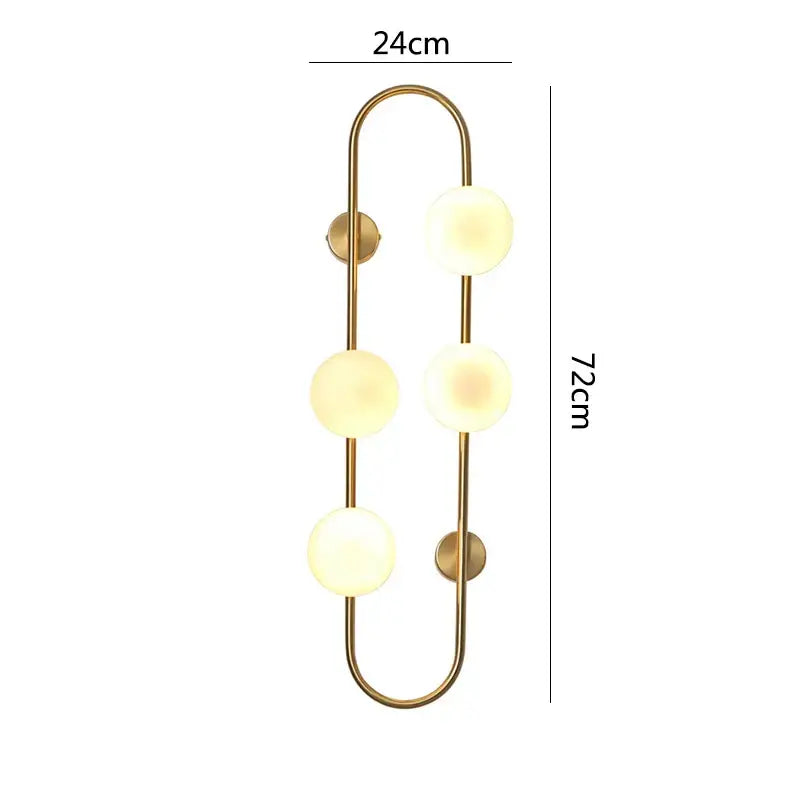 Gold-toned decorbites luxe glass ball wall sconce with three frosted glass spheres for modern bedroom and living room