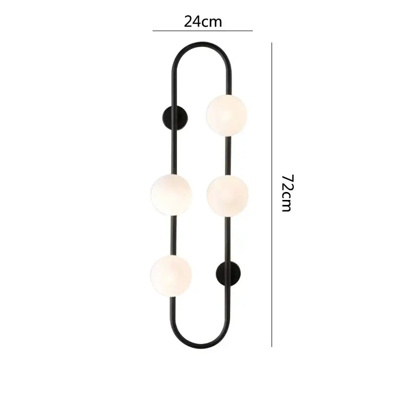 Black metal wall sconce with four frosted glass globe shades in curved design decorbites luxe glass ball for modern rooms