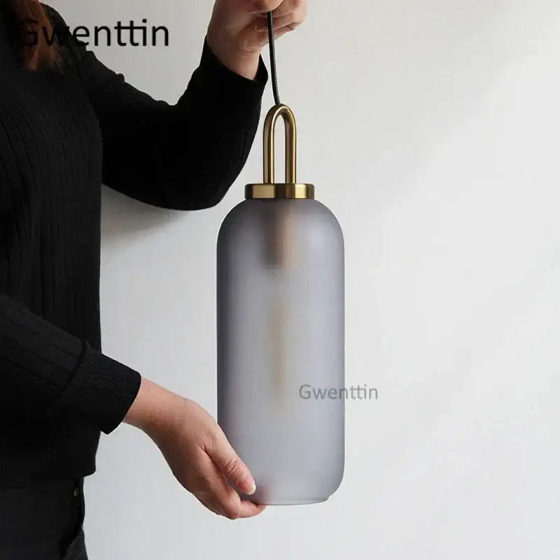 Gray frosted glass ball pendant light with brass metal top and chain by decorbites luxe glass for home decor