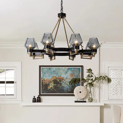 Black and brass geometric glass luxe glass chandelier with five faceted shades by DecorBites Luxe for modern living rooms