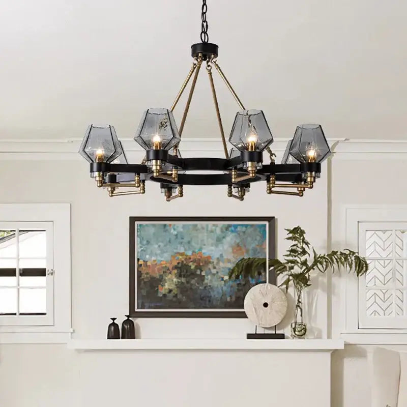 Black and brass geometric glass luxe glass chandelier with five faceted shades by DecorBites Luxe for modern living rooms