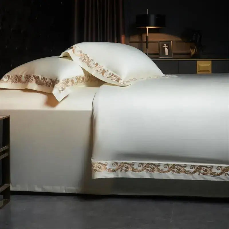 Cream-colored satin bedding set with luxe gold embroidery edges in DecorBites™ 1400TC Egyptian cotton queen king set
