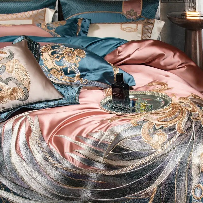 Luxurious satin bedding set in rose gold and teal with intricate luxe gold embroidery by DecorBites™
