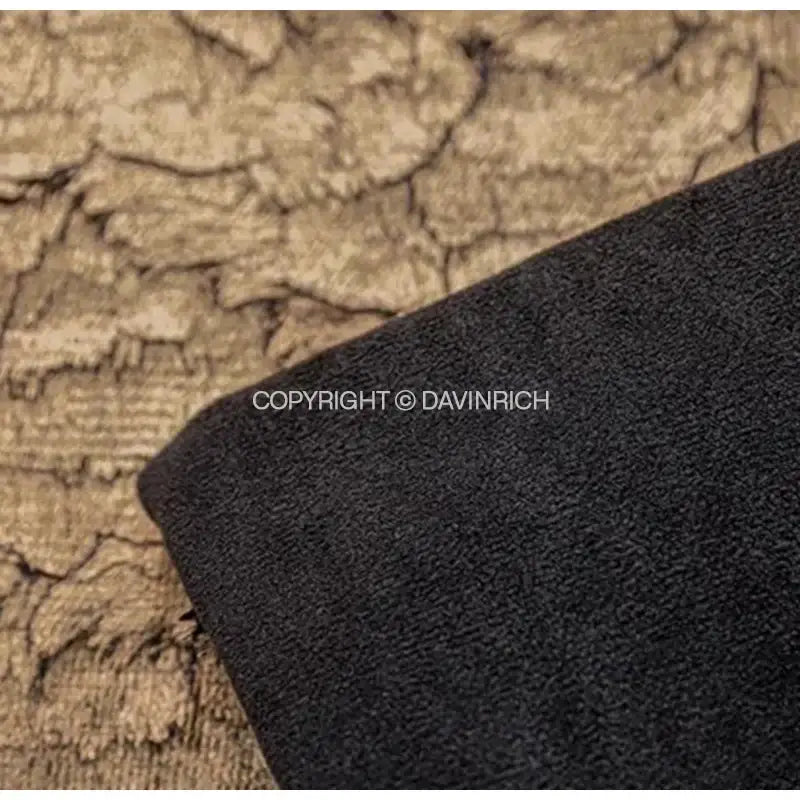 Black textured fabric with a soft plush surface on decorbites luxe gold foil cushion cover 30x50cm