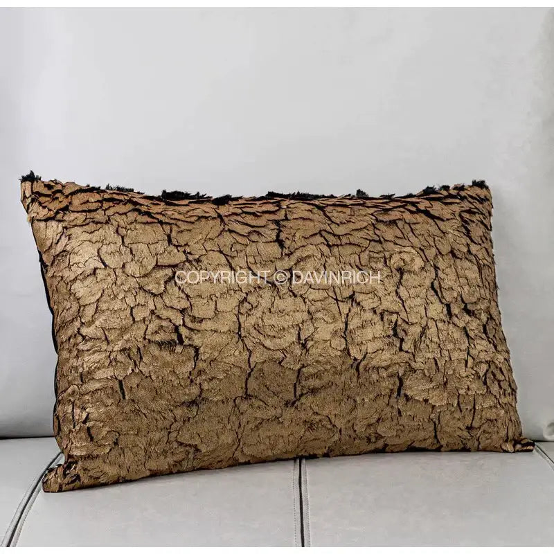 A decorbites luxe gold foil cushion cover with golden-brown cracked bark texture and black frayed edges 30x50cm