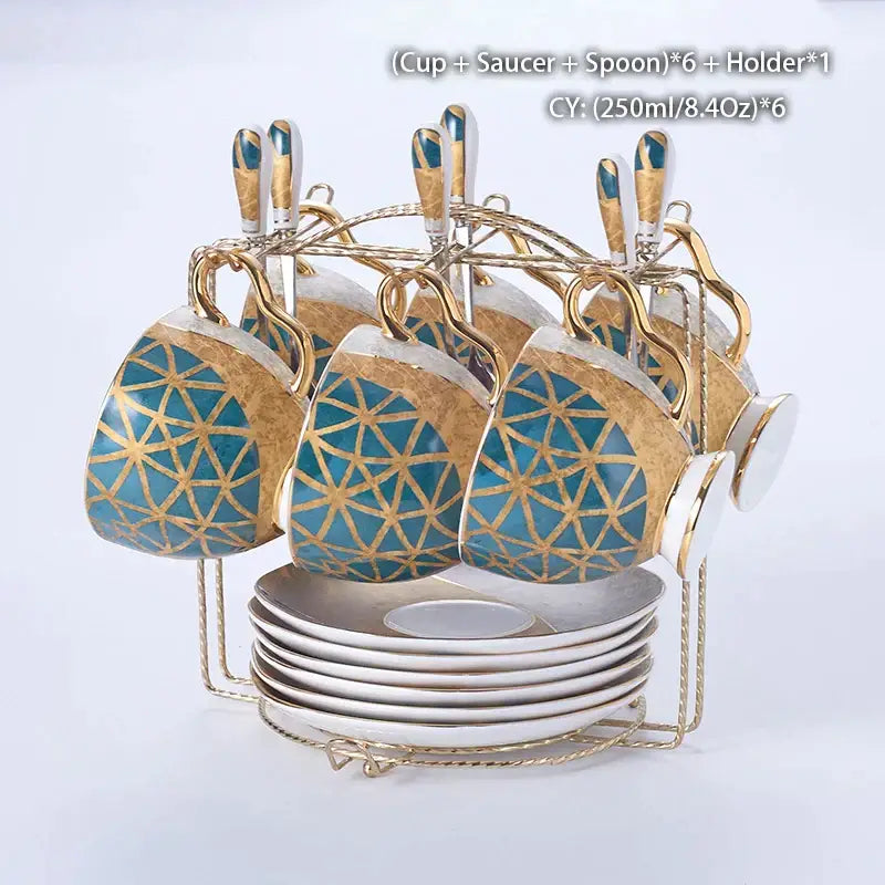 Set of six blue and gold geometric bone china cups with saucers spoons and golden rack from decorbites luxe gold inlay coffee set