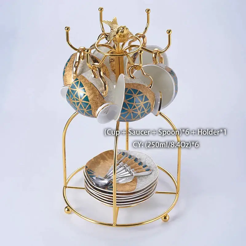 DecorBites™ Luxe Gold inlay bone china coffee set featuring gold-toned cup and saucer with blue geometric patterns and spoons