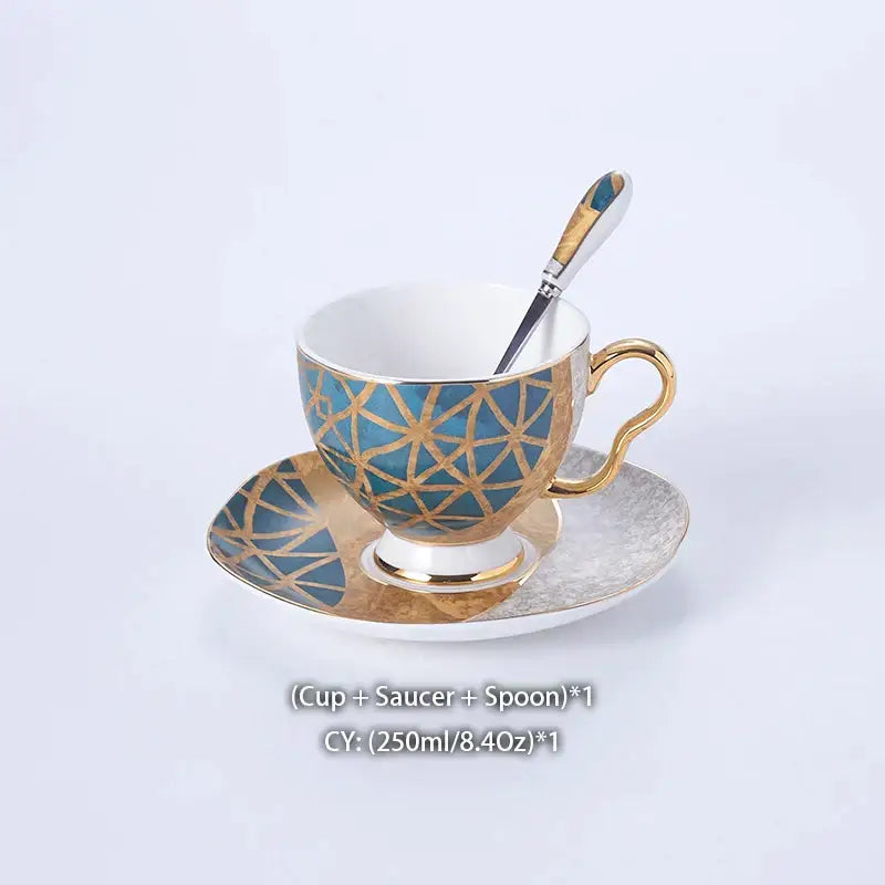 Elegant porcelain teacup with blue and gold geometric gold inlay on matching saucer from DecorBites Luxe Gold coffee set