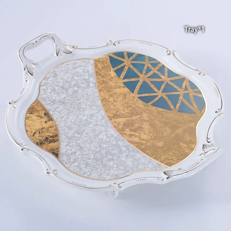 Elegant white ceramic serving tray with gold inlay and ornate silver handles from DecorBites Luxe Gold coffee set