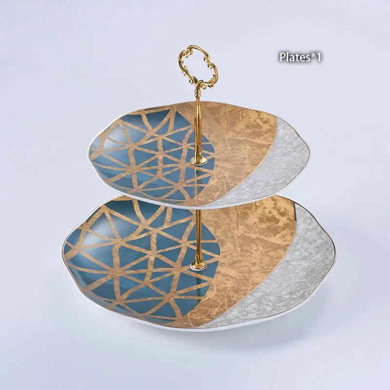Two-tiered serving platter with blue and gold geometric pattern and decorbites luxe gold inlay coffee set accents