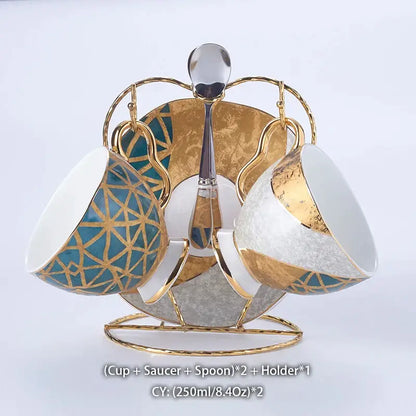 Elegant gold inlay porcelain coffee set with teal patterns on cups and matching saucers displayed on golden stand decorbites luxe gold