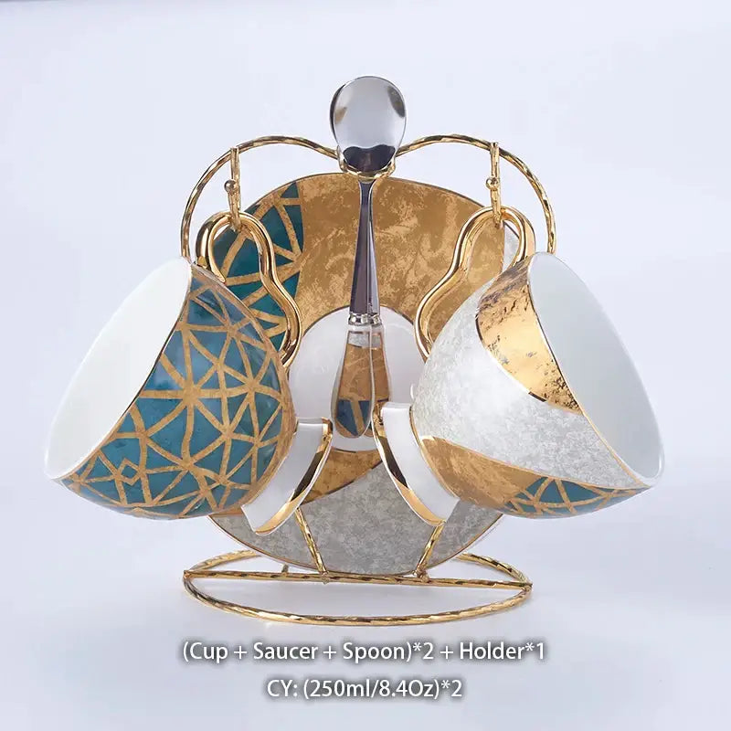 Elegant gold inlay porcelain coffee set with teal patterns on cups and matching saucers displayed on golden stand decorbites luxe gold
