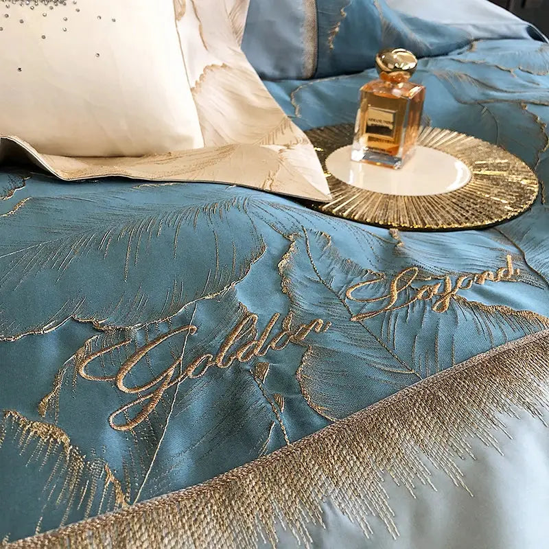 Teal satin jacquard embroidery bedding set with gold leaf embroidery and fringe detailing made of 1000tc egyptian cotton