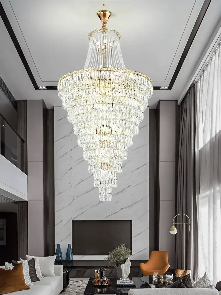 A decorbites luxe golden multi-tiered crystal chandelier with gold-toned frame and clear crystals for elegant spaces