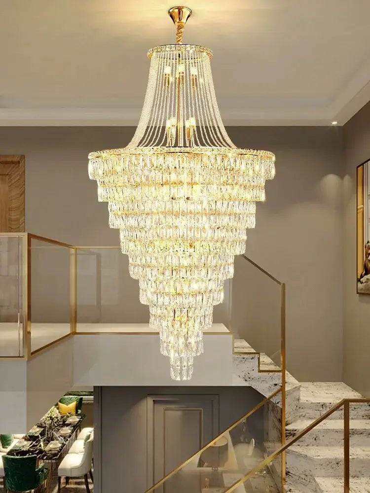 A decorbites luxe golden crystal chandelier with gold metal frame and clear faceted crystals for lobby and living room